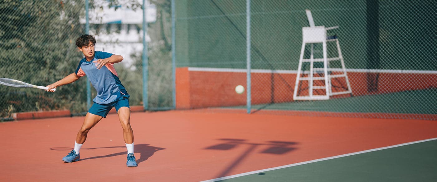 young man playing tennis